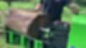 The cylinder of the Yardbeast LZ-505 log splitter is extended and tearing apart a 2 feet wide dry log to convert it into valuable firewood